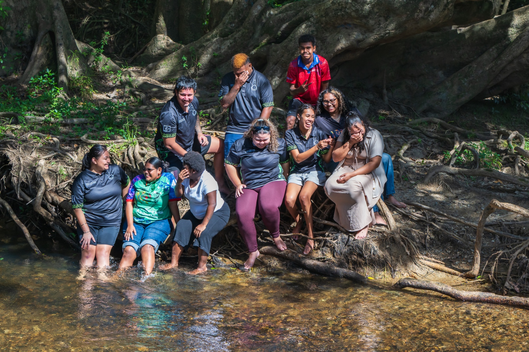 DIYDG team and young people together by the creek